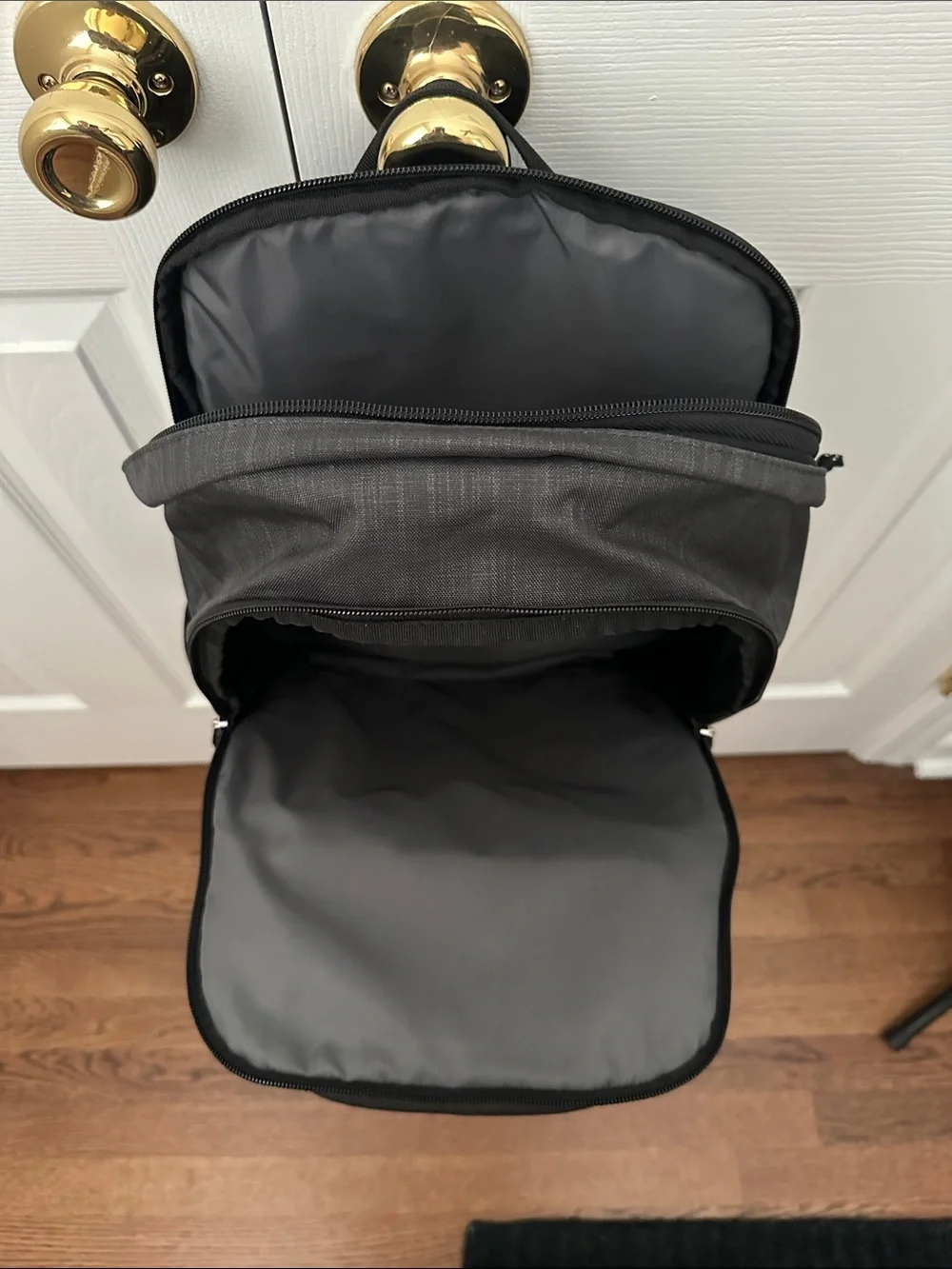 Thule Charcoal Gray Backpack with Teal Accent